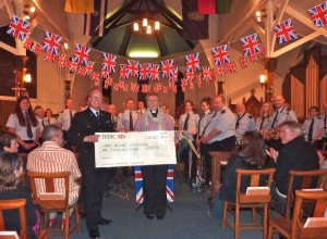 Presenting a cheque to the Army Widows Association at our Night at the Proms concert, 2010